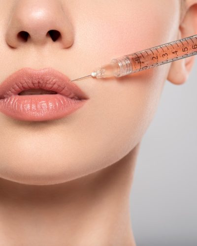 woman-getting-cosmetic-injection-of-botox-in-lips-closeup-.jpg